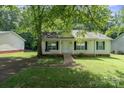 Attractive one-story home with cozy front porch and charming curb appeal at 1013 Ashwood Pl, Salisbury, NC 28146