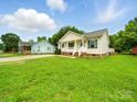 Spacious lawn view of home showcasing its well-kept landscape and classic design elements at 1015 Rhode Island Ave, Kannapolis, NC 28083