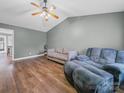 Cozy living room with vaulted ceilings, ceiling fan, and comfortable seating arrangement at 1015 Rhode Island Ave, Kannapolis, NC 28083