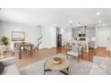 Bright, open-concept living room and kitchen with hardwood floors and modern finishes at 1022 Maltby St, Charlotte, NC 28217
