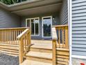 Inviting wooden porch with a glass door and windows, offering a cozy entrance to the home at 1117 Hidden Brook Ln, Clover, SC 29710