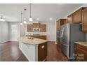 Spacious kitchen boasts granite countertops, an island, and stainless steel appliances at 128 Yellowbell Rd, Mooresville, NC 28117