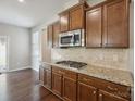 Well-equipped kitchen with a gas cooktop, stainless steel appliances, and ample cabinet space at 128 Yellowbell Rd, Mooresville, NC 28117