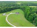 Aerial shot showcasing the home's expansive lot, long driveway, and serene, wooded surroundings at 1347 Norman Dr, Rock Hill, SC 29732