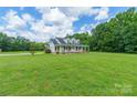 Charming two-story home with a large, inviting porch and well-maintained lawn, perfect for outdoor relaxation at 1347 Norman Dr, Rock Hill, SC 29732