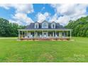 Inviting front exterior featuring a wide porch with comfortable seating and well-kept landscaping at 1347 Norman Dr, Rock Hill, SC 29732
