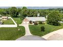 Beautiful brick home with mature trees, well maintained lawn, and long driveway at 139 Hardwick Dr, Mooresville, NC 28115