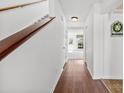 Bright foyer with wood floors, white walls, staircase, and decorative wall accents at 1670 Robins Nest Ct # D, Gastonia, NC 28054