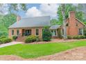 Beautiful brick home with well-maintained lawn and mature trees at 2332 Hemby Pl, Charlotte, NC 28270
