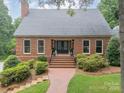 Inviting brick home with double front doors and a brick walkway at 2332 Hemby Pl, Charlotte, NC 28270