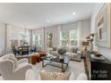 Open-concept living room with modern furnishings and lots of natural light at 2600 Mason Cir # A, Charlotte, NC 28205