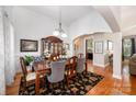 Elegant dining room featuring hardwood floors, a decorative rug, and a sophisticated chandelier at 2804 Pulaski Dr, Monroe, NC 28110