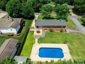 Aerial view featuring a backyard with a deck and in-ground swimming pool at 306 2Nd Avenue Ne Pl, Conover, NC 28613