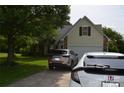 Home exterior featuring a driveway with two cars and attached garage at 3136 Blueberry Dr, Monroe, NC 28110