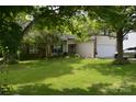Charming home featuring well-manicured lawn, mature trees, and a welcoming front entrance at 3136 Blueberry Dr, Monroe, NC 28110