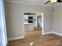 Open-concept living room showing entry to a modern kitchen, perfect for entertaining at 339 Mayflower Ave, Cramerton, NC 28032