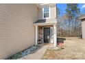 Close-up of the front entrance, featuring a stone accent wall and stylish entryway at 3735 Ernie Dr, Charlotte, NC 28269