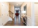 Elegant foyer featuring hardwood floors, staircase, and view into the living room at 385 Willow Tree Dr, Rock Hill, SC 29732