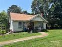 Charming home with a manicured lawn and walkway leading to the front porch at 4059 10Th Avenue Sw Dr, Hickory, NC 28602