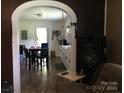 View of kitchen with white cabinets and dining table and chairs at 448 Belk St, Lancaster, SC 29720