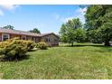 Well maintained front yard with decorative bushes and green grass at 5563 Grace Chapel Rd, Hickory, NC 28601