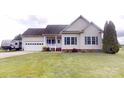 Well maintained one story home with a two car garage and manicured lawn at 6825 Woodleaf Rd, Woodleaf, NC 27054