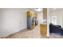 Cozy kitchen featuring stainless steel appliances and wood cabinetry at 6825 Woodleaf Rd, Woodleaf, NC 27054