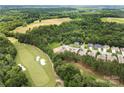 Serene aerial view of a neighborhood near a lush golf course and beautiful greenery in the background at 765 Cherry Hills Pl, Rock Hill, SC 29730