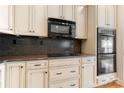 Kitchen features modern appliances, granite countertops, and custom cabinets offering a functional and elegant space at 765 Cherry Hills Pl, Rock Hill, SC 29730