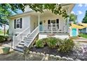 Attractive home with a welcoming front porch, complemented by neat landscaping at 805 Caldwell St, Belmont, NC 28012