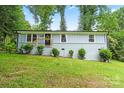 Charming single-story home with light blue painted brick and siding, complemented by fresh landscaping at 10514 Harbor Dr, Charlotte, NC 28214