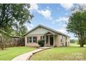 Charming bungalow-style home featuring a quaint front porch and well-maintained lawn at 1145 Earl Rd, Shelby, NC 28152