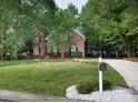 Lovely two-story brick home with manicured lawn, complemented by a mailbox and long driveway at 1587 Summit View Dr, Rock Hill, SC 29732