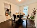 A cozy dining area boasts a round table set for four, next to the kitchen at 2008 Bantry Ln, Charlotte, NC 28262