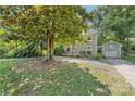 Spacious front yard featuring a mature tree providing ample shade to this charming home at 2034 Lanier Ave, Charlotte, NC 28205