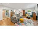 Bright living room with hardwood floors, traditional furnishings and access to the kitchen at 2034 Lanier Ave, Charlotte, NC 28205