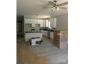 Bright kitchen boasts white cabinets, dark countertops, stainless appliances, and modern lighting fixtures at 2560 S Jake Alexander S Blvd, Salisbury, NC 28146