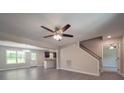 Spacious living room featuring an open floor plan with views of the dining area and modern kitchen at 292 Manchester Rd, Mount Gilead, NC 27306