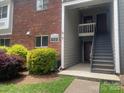 Building exterior showcasing the entryway and access to units at 3200 Heathstead Pl # E, Charlotte, NC 28210