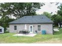 View of the backyard with a small patio and outdoor furniture set at 604 E Ohio Ave, Bessemer City, NC 28016
