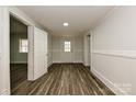 Bright hallway featuring wood-look floors, crisp white trim and neutral walls at 613 E Liberty St, Salisbury, NC 28144