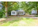 Quaint one-story home with mature trees and a well-maintained lawn at 636 Forest Nw St, Concord, NC 28025