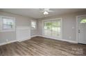 Bright living room with a decorative fireplace and large windows that let in plenty of natural light at 636 Forest Nw St, Concord, NC 28025