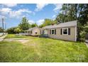 One-story home with a front porch and dark shutters, with some damage visible at 638 E Black St, Rock Hill, SC 29730