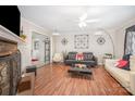 A well-decorated living room with hardwood floors and stylish furniture arrangement at 713 Hickory Hill Ct, Gastonia, NC 28054