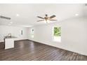 Bright, open-concept living space with wood floors, recessed lighting, and natural light at 812 Generation Ln, Clover, SC 29710