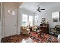 Bright living room boasting hardwood floors, a ceiling fan, natural light, and comfortable seating at 914 Greenbridge Dr, Matthews, NC 28105