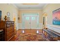Welcoming foyer with hardwood floors, a decorative rug, and an elegant double-door entryway at 9330 Carneros Creek Rd, Charlotte, NC 28214