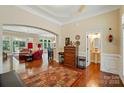 Open-concept living area with hardwood floors, elegant trim, and ample space for entertaining and relaxing at 9330 Carneros Creek Rd, Charlotte, NC 28214