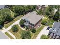 Aerial view of a beautiful home, showcasing its landscaped yard and outdoor space in a lush, green neighborhood at 11335 Wescott Hill Dr, Huntersville, NC 28078
